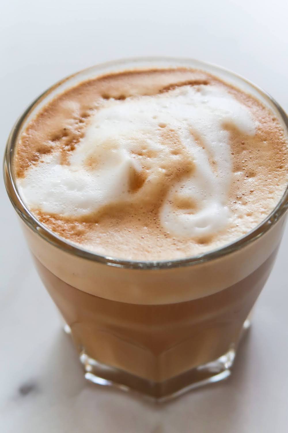 Learn how to make cappuccino or latte at home without a frother or a machine! The result of this super easy cappuccino recipe will be a cup of cappuccino with thick creamy foam that stays a long time.