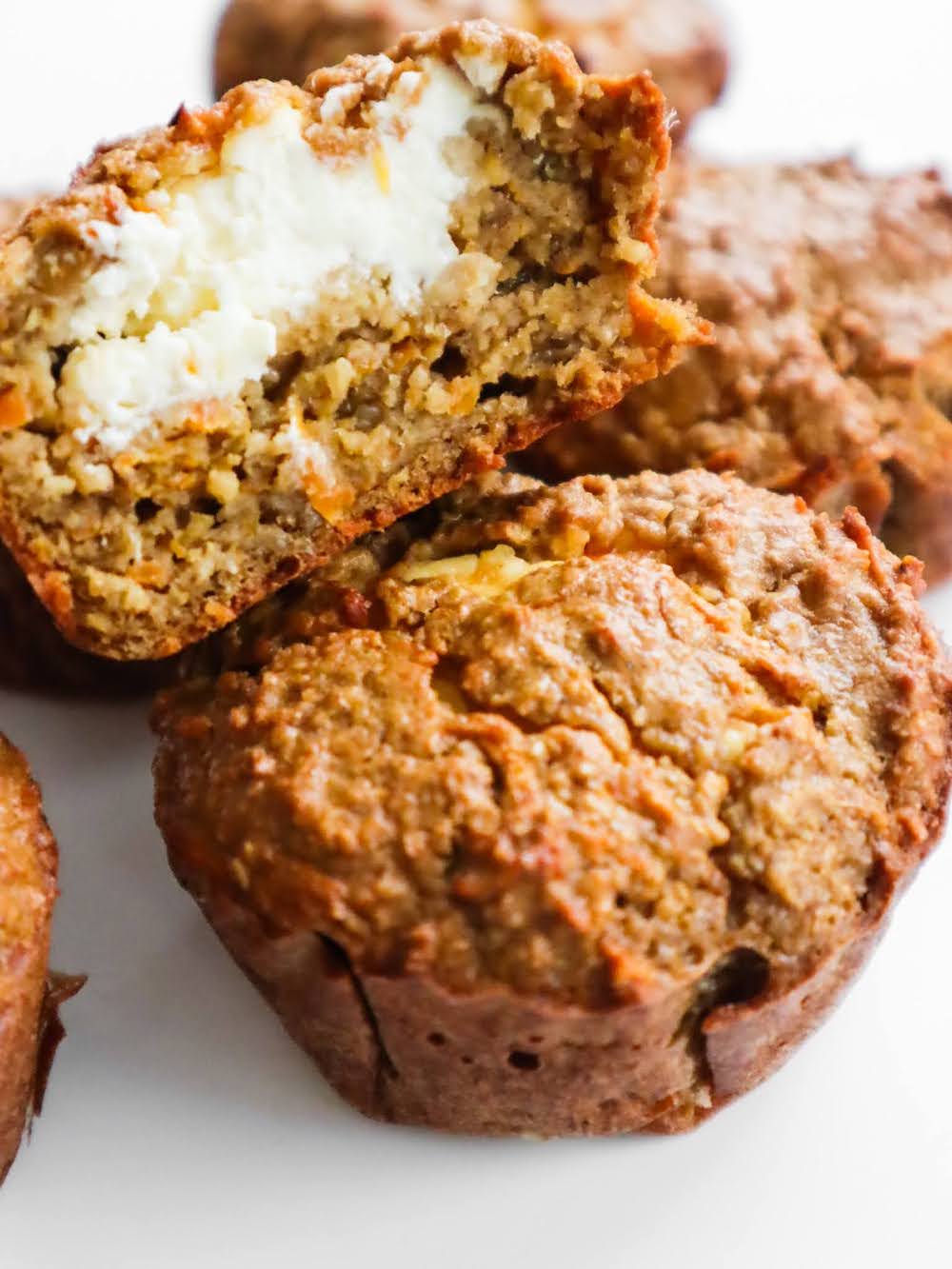 A recipe for flourless healthy carrot cake muffins with oats - after one bite you'll discover an irresistible cream cheese filling.