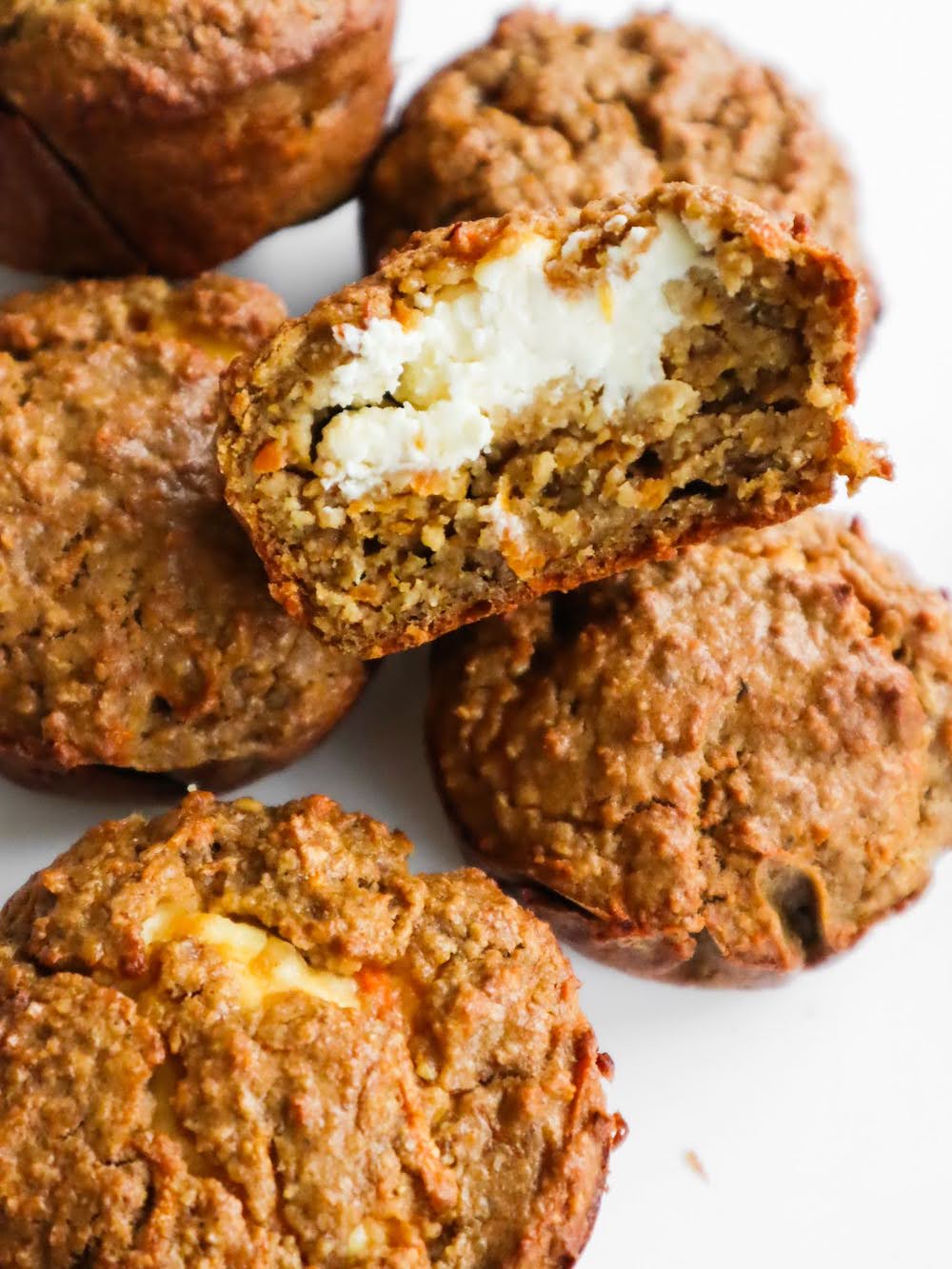 A recipe for flourless healthy carrot cake muffins with oats - after one bite you'll discover an irresistible cream cheese filling.