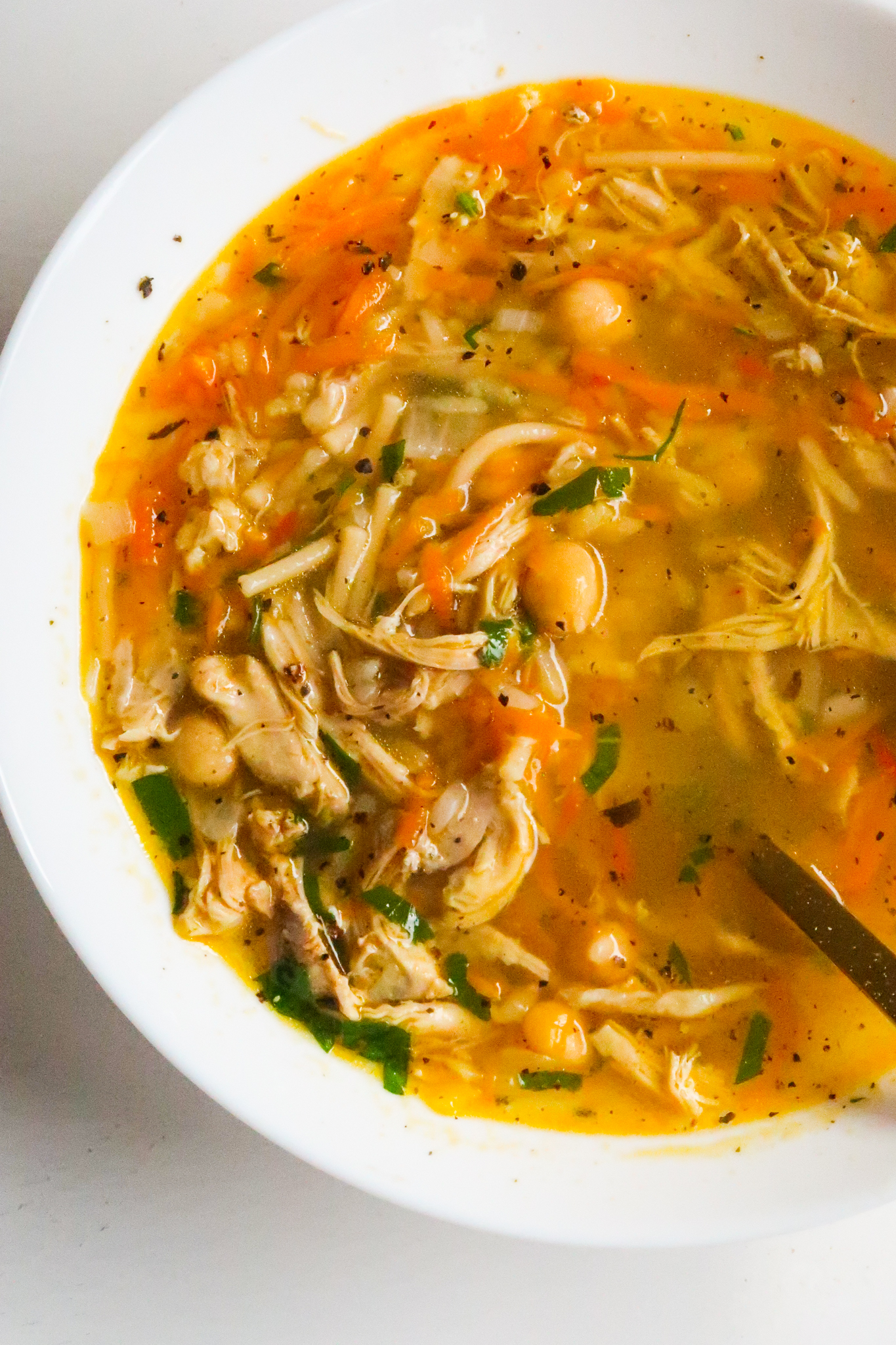 Nothing more comforting than a bowl of hearty homemade chicken soup! This is a delicious protein-packed easy healthy chicken soup recipe made with chickpeas, vegetables and noodles. This healthy soup recipe is ready in about 45 minutes from start to finish.