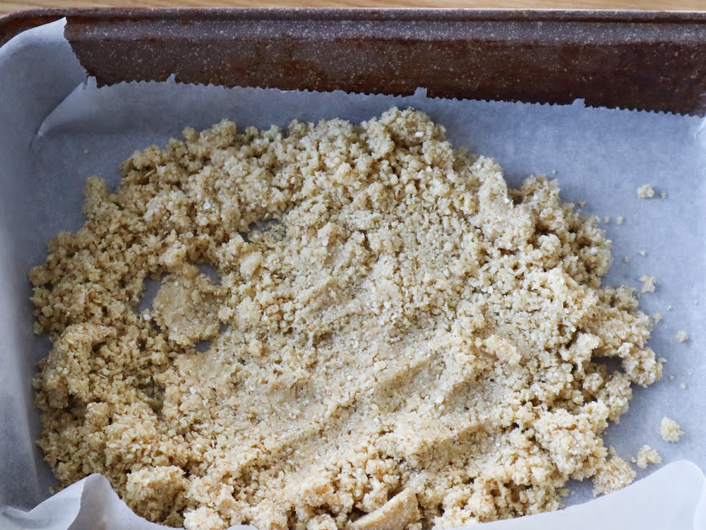 spreading almond flour crust