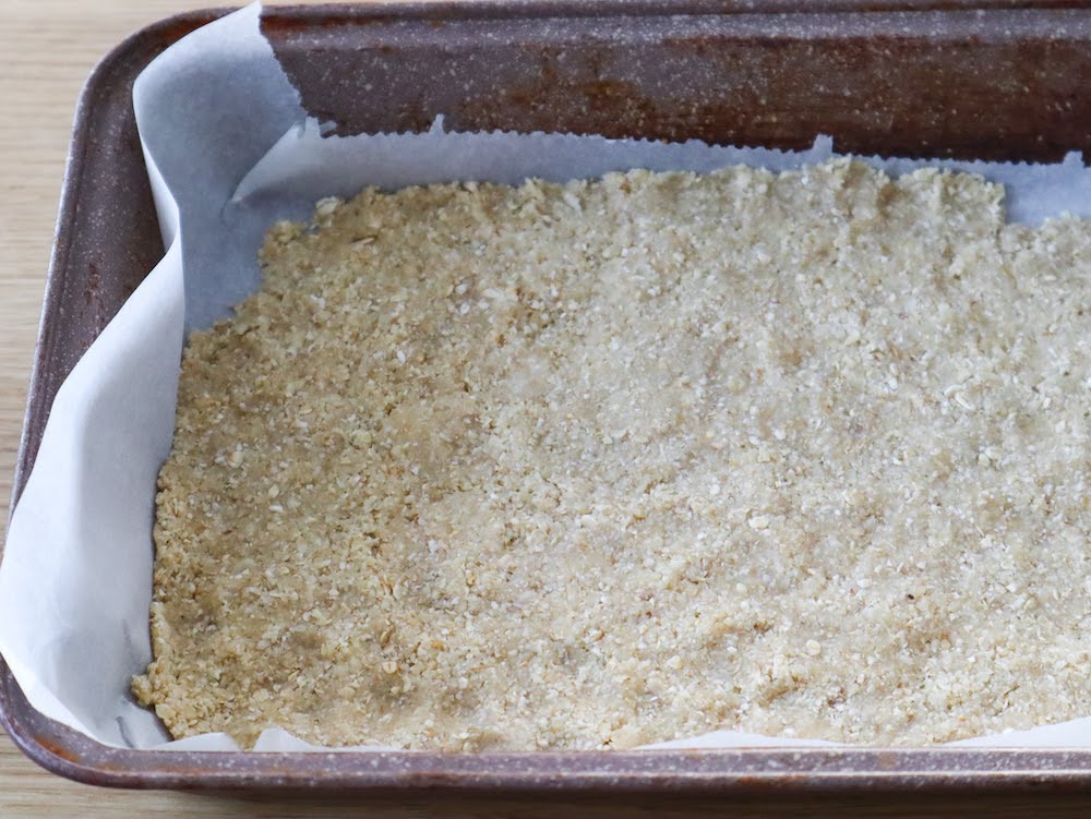 spreading almond flour crust