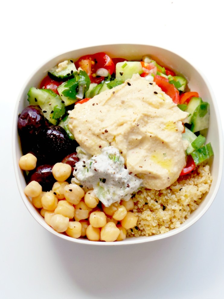 5-Minute Mediterranean Bowl - easy and healthy meal prep lunch or dinner. This vegan Mediterranean bowl is made with hummus, tzatziki, chickpeas, olives, quinoa and a small healthy salad. It's also gluten-free.