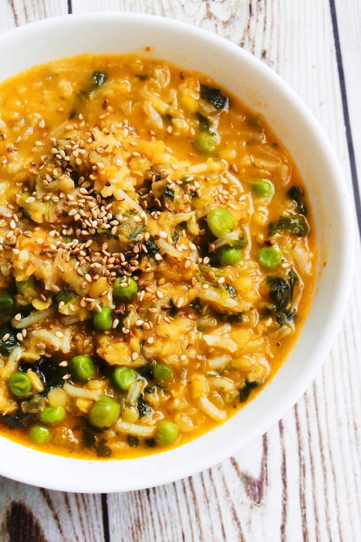 Red curry coconut lentil soup with rice and peas - creamy, easy lentil recipe that you'll want to eat every day! This healthy soup is spicy, tasty and comforting. It's also vegan, paleo and rich in fiber! | clean eating recipes