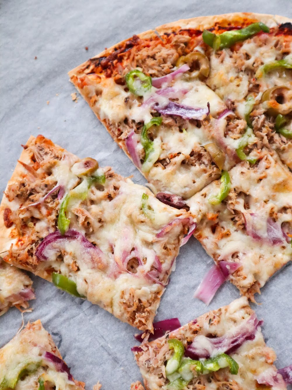 Easy Tuna Pizza Recipe! Grab some canned tuna and tortillas and make this delicious easy tuna pizza for dinner tonight! High protein and low in calories, this tuna recipe is a fairly healthy option as well.