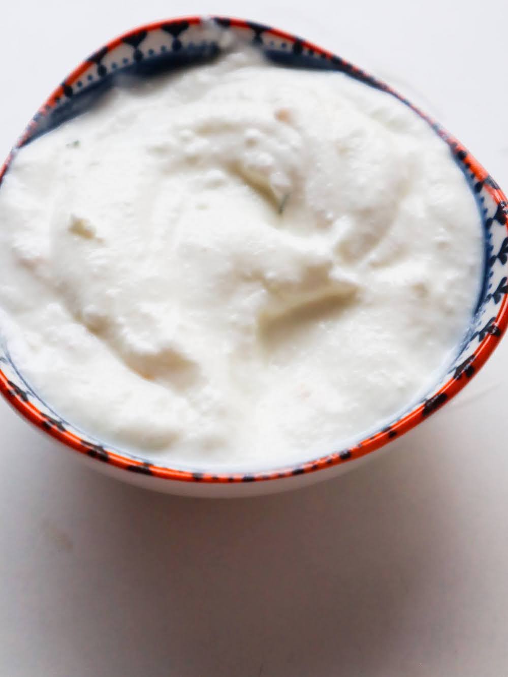 This yogurt garlic sauce recipe goes with bowls, wraps, grilled meat fish and vegetables, with salads or slow cooked meals. It's similar to tzatziki, but even easier to put together!